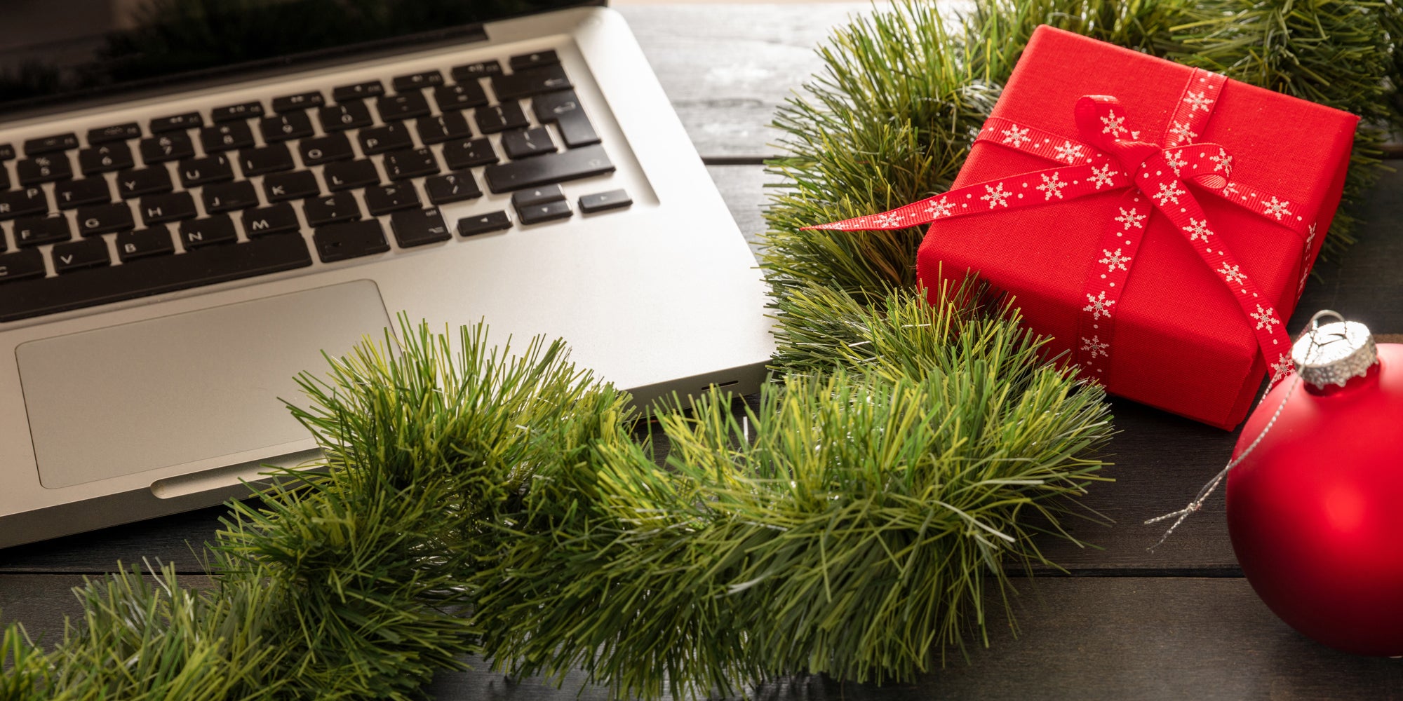 A person working at a desk during the holiday season, surrounded by decorations and papers